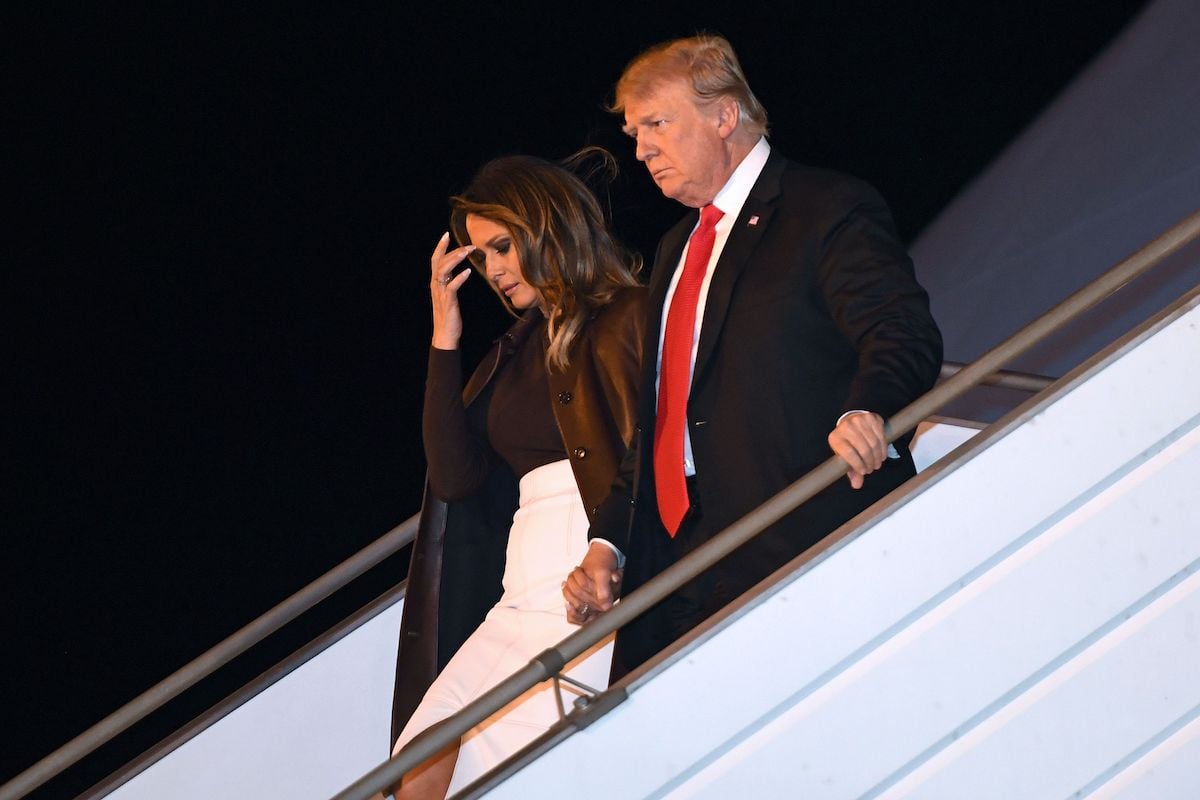 US President Donald Trump and First Lady Melania Trump disembark from Air Force One upon arrival in Buenos Aires, Argentina, on November 29, 2018, as they travel to attend the G20 summit. - US President Donald Trump jets into Argentina on Thursday for a G20 summit, keen to do battle with China on trade and sharpening his rhetoric against Russia over Ukraine. (Photo credit: LOEB/AFP/Getty Images)