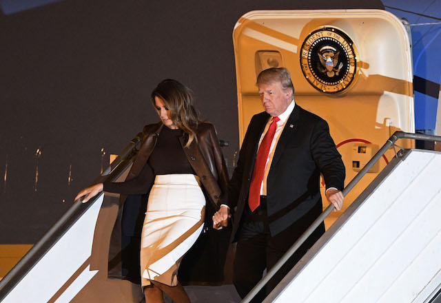US President Donald Trump (R) and US First Lady Melania Trump, disembark from Air Force One upon arrival at Ezeiza International airport in Buenos Aires province, on November 29, 2018, on the eve of the G20 Leaders' Summit. - US President Donald Trump jets into Argentina on Thursday for a G20 summit, keen to do battle with China on trade and sharpening his rhetoric against Russia over Ukraine.(Photo credit: JUAN MABROMATA/AFP/Getty Images)