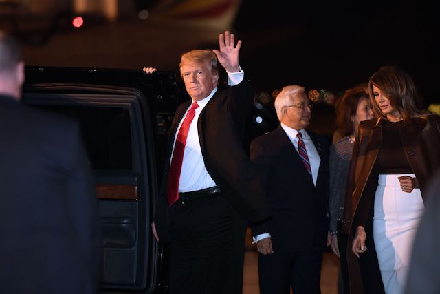 US President Donald Trump and First Lady Melania Trump disembark from Air Force One upon arrival in Buenos Aires, Argentina, on November 29, 2018, as they travel to attend the G20 summit. (Photo credit: SAUL LOEB/AFP/Getty Images)