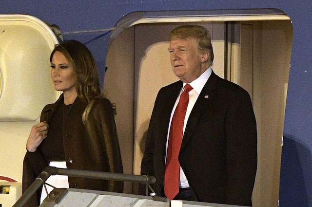 US President Donald Trump (R) and US First Lady Melania Trump, are pictured before leaving Air Force One, upon arrival at Ezeiza International airport in Buenos Aires province, on November 29, 2018, on the eve of the G20 Leaders' Summit. - US President Donald Trump jets into Argentina on Thursday for a G20 summit, keen to do battle with China on trade and sharpening his rhetoric against Russia over Ukraine. (Photo credit: JUAN MABROMATA/AFP/Getty Images)
