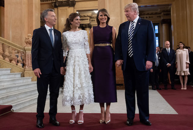 US President Donald Trump (R) and her wife US First Lady Melania Trump (2-R) pose with Argentina's President Mauricio Macri (L) and his wife Argentina's First Lady Juliana Awada, prior to a gala at the Colon Theater in Buenos Aires, on November 30, 2018 in the sidelines of the G20 Leader's Summit. (Photo credit: SAUL LOEB/AFP/Getty Images)
