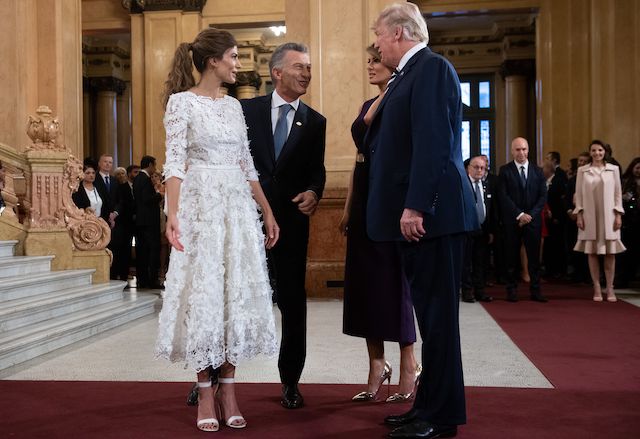 US President Donald Trump (R) and her wife US First Lady Melania Trump (2-R) speak with Argentina's President Mauricio Macri (2-L) and his wife Argentina's First Lady Juliana Awada, prior to a gala at the Colon Theater in Buenos Aires, on November 30, 2018 in the sidelines of the G20 Leader's Summit. (Photo credit: SAUL LOEB/AFP/Getty Images)