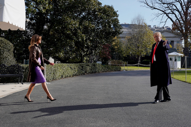 U.S. President Donald Trump turns to reporters as he departs with first lady Melania Trump for travel to the G-20 summit in Argentina from the White House in Washington, U.S., November 29, 2018. REUTERS/Jonathan Ernst