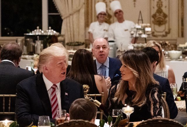 US President Donald Trump and US First Lady Melania Trump sit down for Thanksgiving dinner at his Mar-a-Lago resort in Palm Beach, Florida on November 22, 2018. (Photo credit: MANDEL NGAN/AFP/Getty Images)