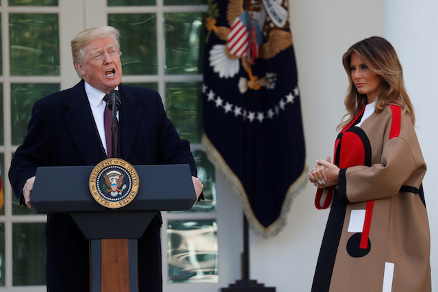 U.S. President Donald Trump speaks next to first lady Melania Trump during the 71st presentation of the National Thanksgiving Turkey in the Rose Garden of the White House in Washington, U.S., November 20, 2018. REUTERS/Leah Millis