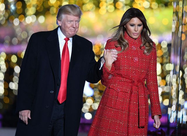 US President Donald Trump (L) and First lady Melania Trump arrive for the 95th annual National Christmas Tree Lighting ceremony at the Ellipse in President's Park near the White House in Washington, DC on November 30, 2017. (Photo credit: JIM WATSON/AFP/Getty Images)