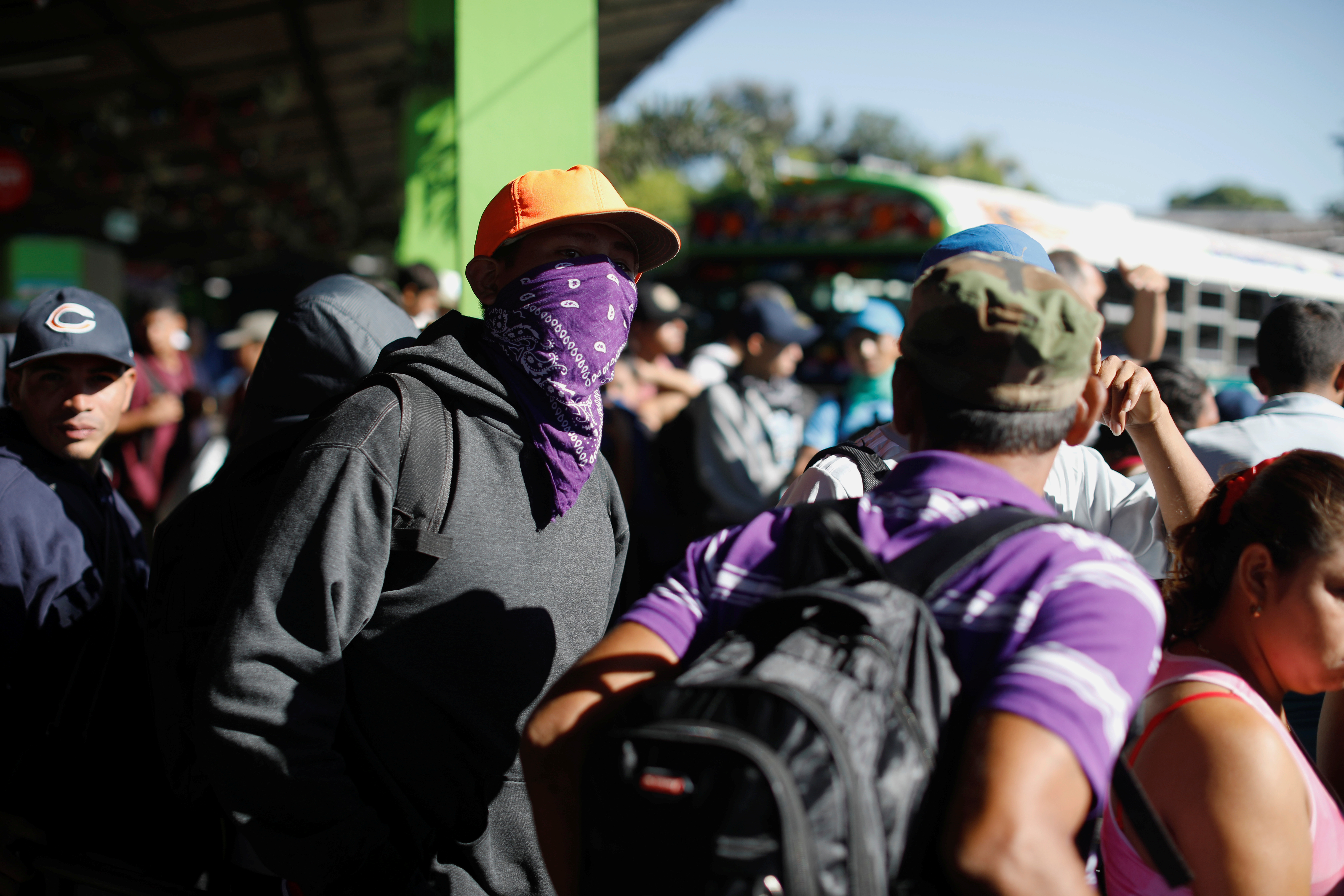 People walk in a caravan of migrants departing from El Salvador en route to the United States, in San Salvador, El Salvador, November 18, 2018. REUTERS/Jose Cabezas