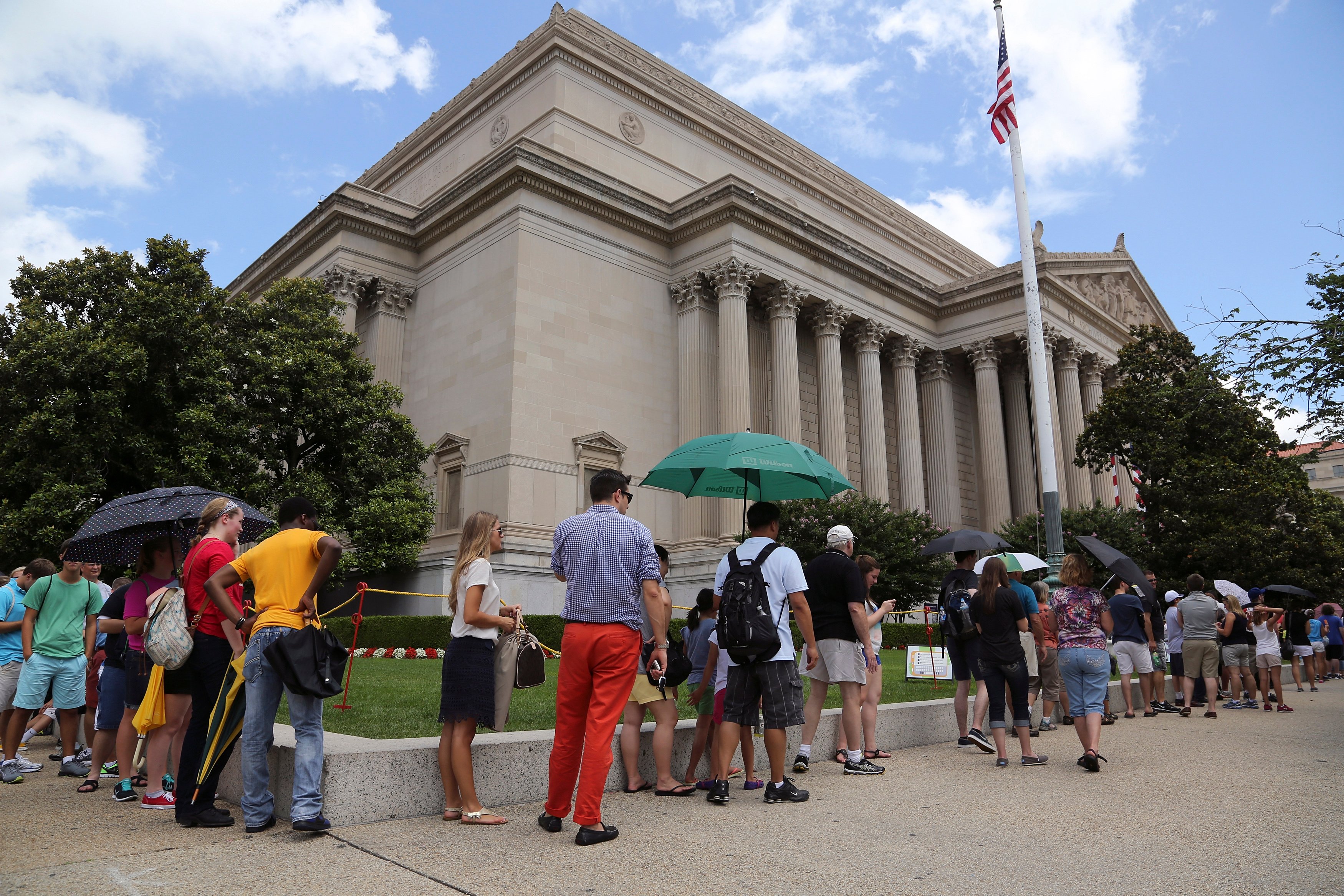 FILE -- Visitors wait in line to enter the National Archives, where the Declaration of Independence is displayed, ahead of the Fourth of July Independence Day observance in Washington, July 3, 2013. REUTERS/Jonathan Ernst 