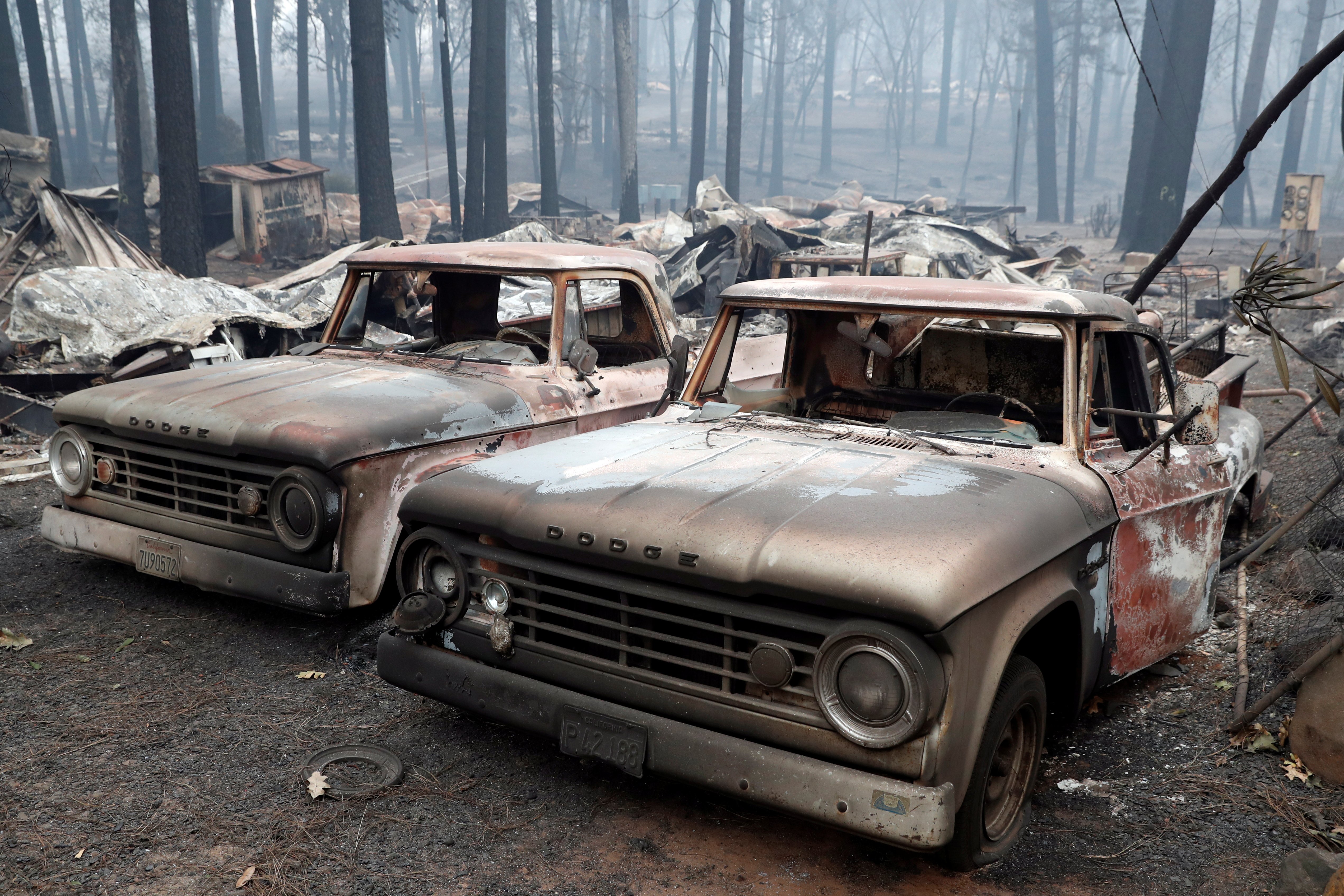 Trucks destroyed by the Camp Fire are seen in Paradise, California, U.S., November 14, 2018. REUTERS/Terray Sylvester