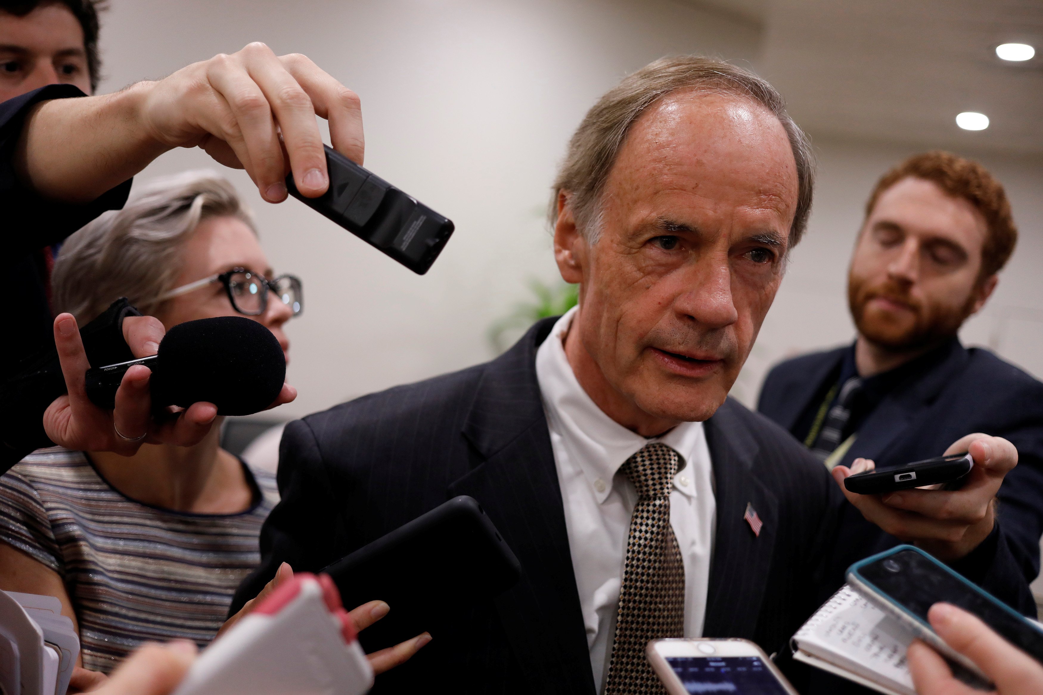 Senator Tom Carper speaks to reporters ahead of the weekly party luncheons on Capitol Hill in Washington