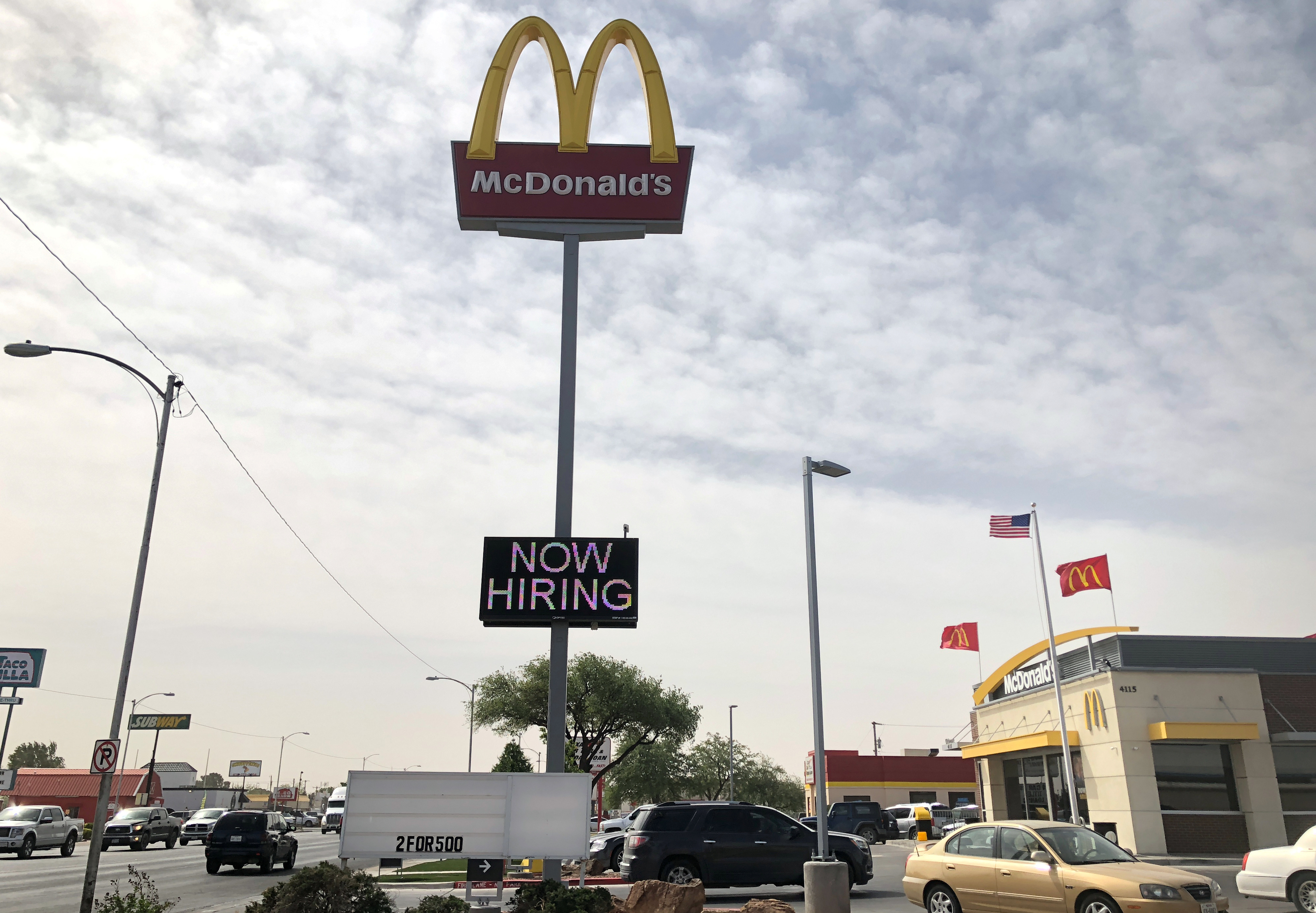 A McDonald's restaurant displays a 'Now Hiring' sign, one of many seen at businesses where an oil boom is fueling worker shortages, in Odessa, Texas, U.S., April 13, 2018. REUTERS/Ann Saphir