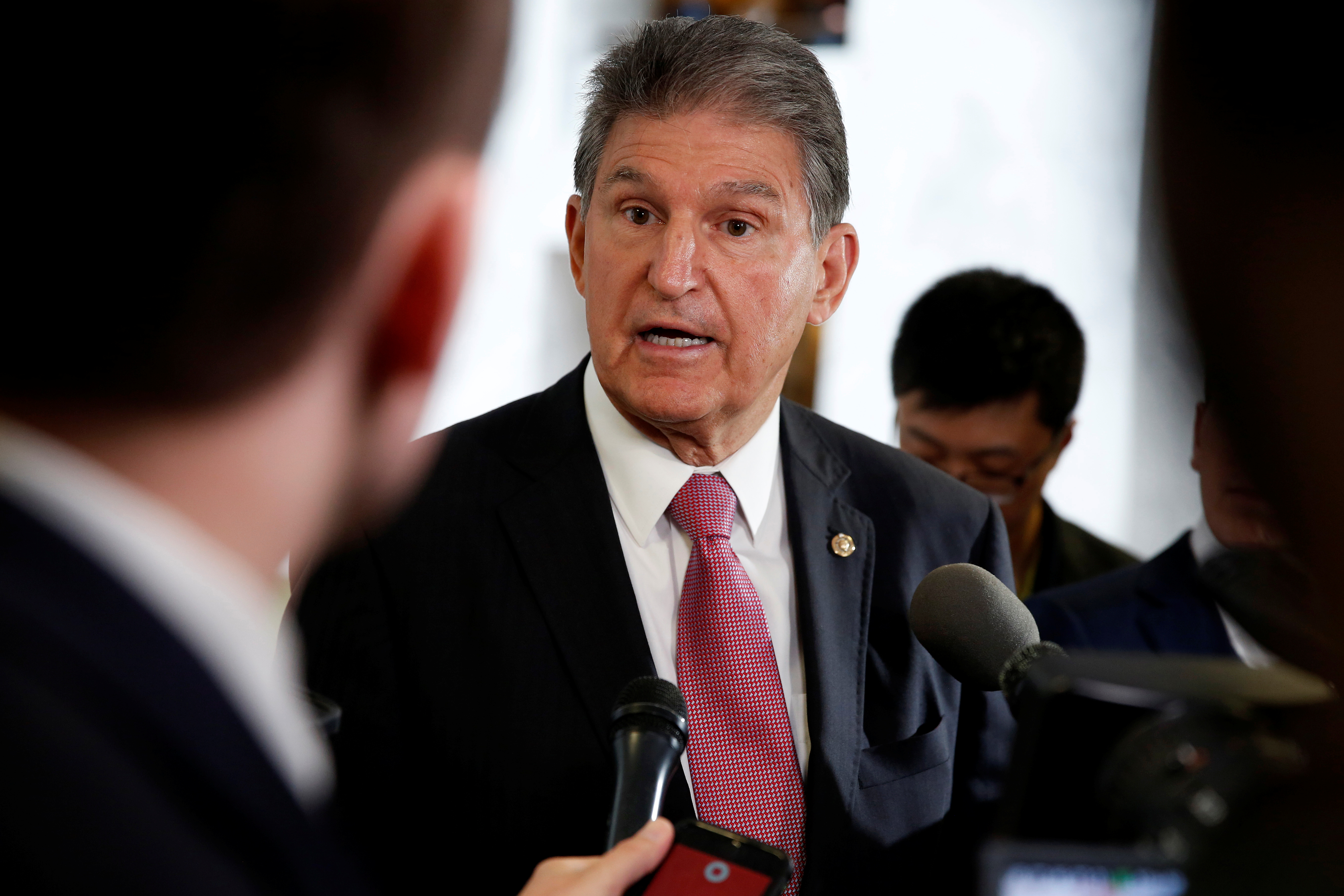 Senator Joe Manchin (D-WV) speaks to the media as he arrives for a Senate Intelligence Committee hearing evaluating Russian interference in U.S. elections