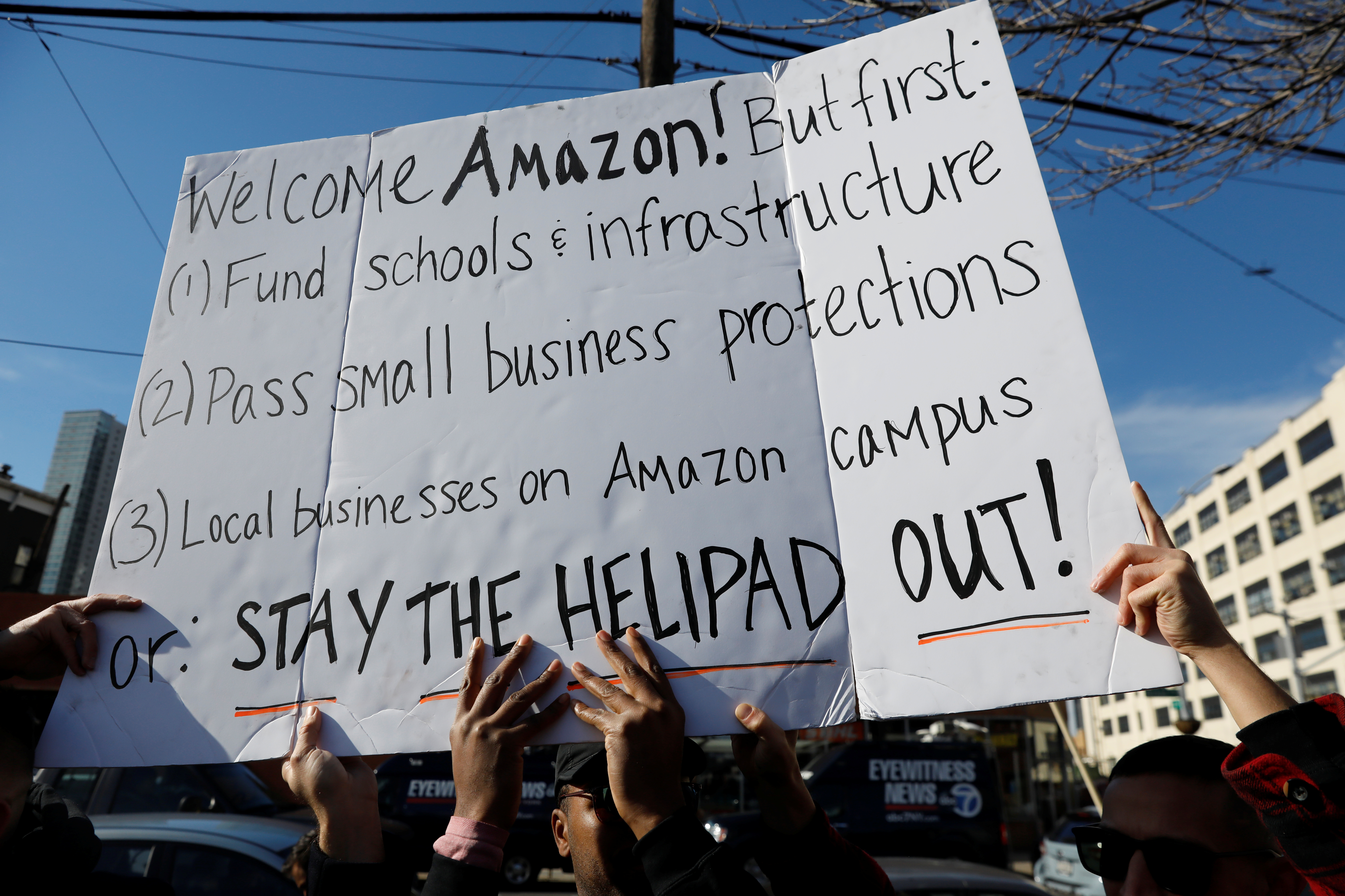 Demonstrators gather to protest Amazon's new location workplace in Long Island City of the Queens borough of New York, U.S., November 14, 2018. REUTERS/Shannon Stapleton - RC18233EC810