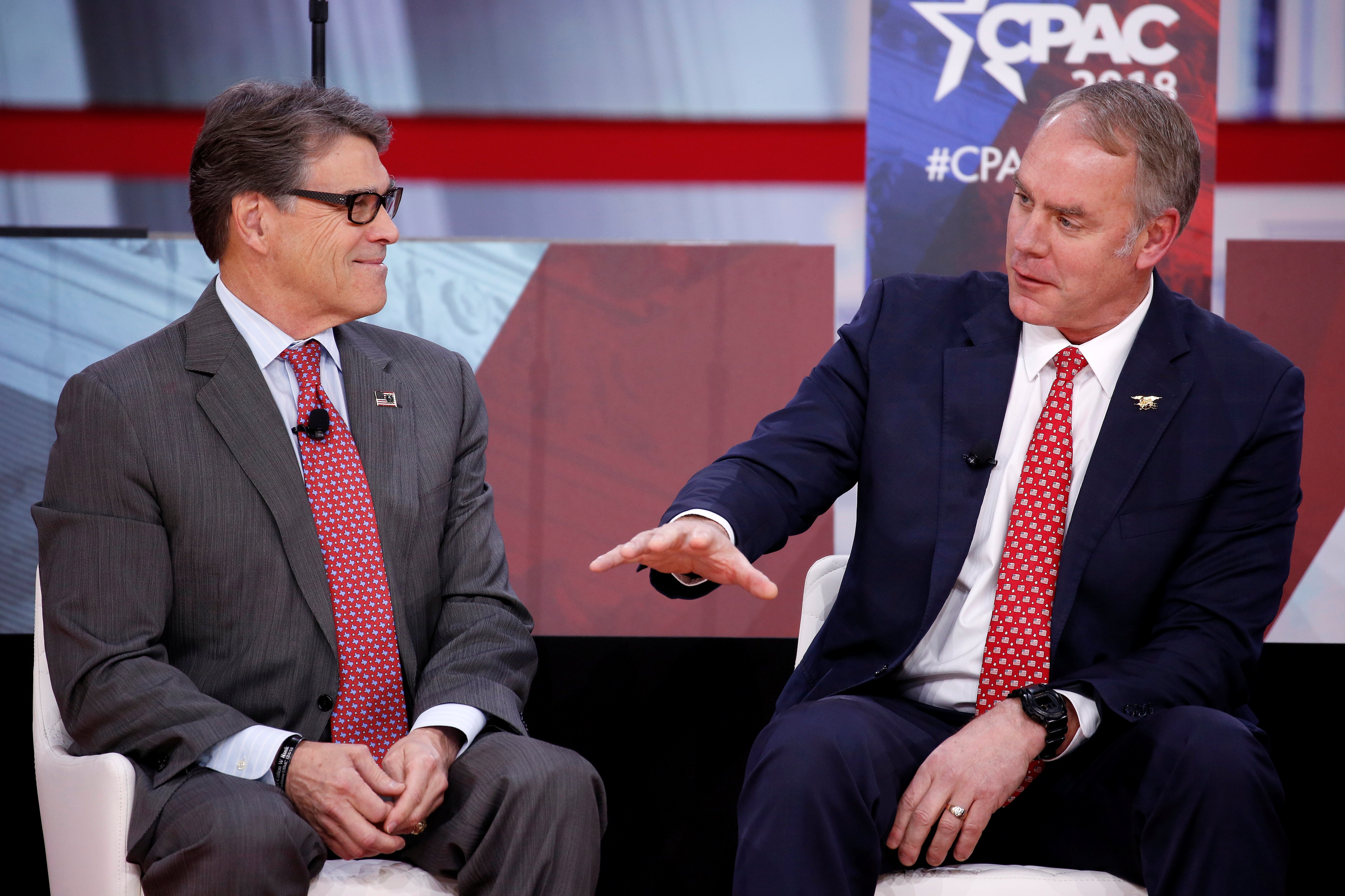 U.S. Secretary of Energy Rick Perry and U.S. Secretary of Interior Ryan Zinke speak at the Conservative Political Action Conference (CPAC) at National Harbor, Maryland, U.S., February 23, 2018. REUTERS/Joshua Roberts