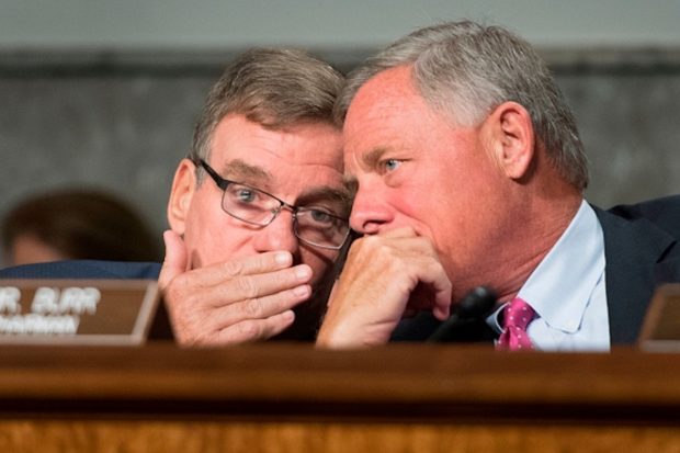 Senate Intelligence Committee Chairman Richard Burr, right, talks with Vice Chairman Mark Warner on Capitol Hill in Washington, DC, on September 5, 2018. (JIM WATSON/AFP/Getty Images)
