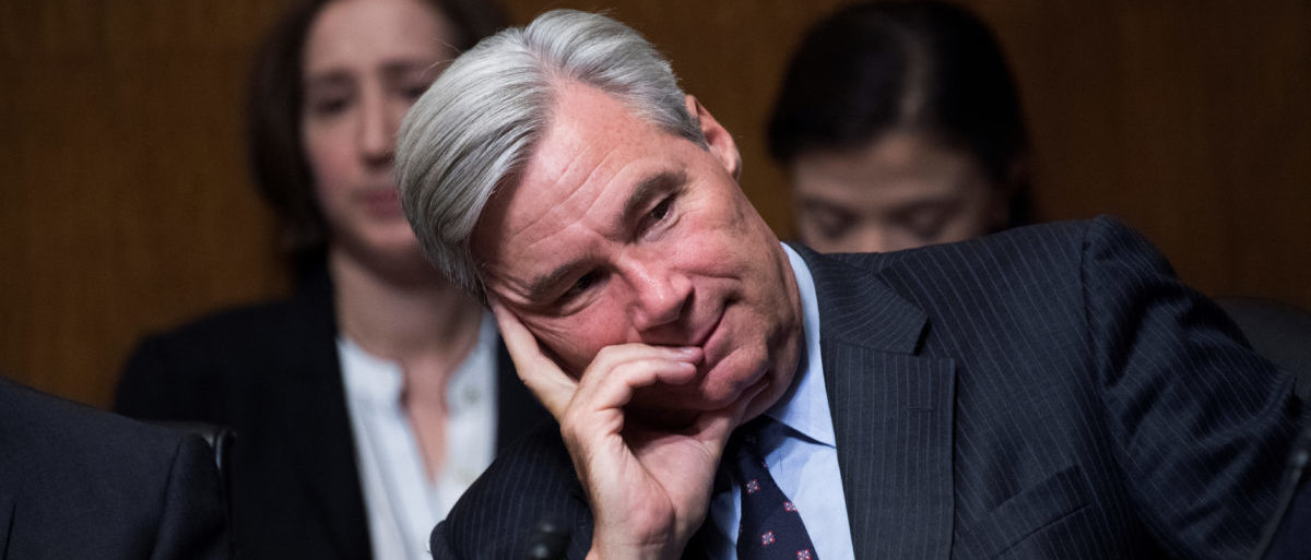 Sen. Sheldon Whitehouse, D-R.I., listens to testimony by Dr. Christine Blasey Ford during the Senate Judiciary Committee hearing on the nomination of Brett M. Kavanaugh to be an associate justice of the Supreme Court of the United States, focusing on allegations of sexual assault by Kavanaugh against Christine Blasey Ford in the early 1980s. Sen. Orrin Hatch, R-Utah, also appears, in Washington, DC, U.S., September 27, 2018. Picture taken September 27, 2018. Tom Williams/Pool via REUTERS
