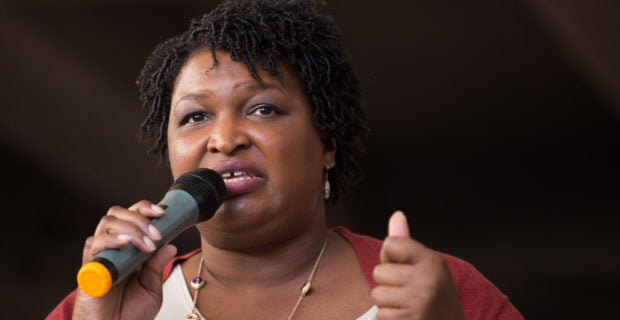 Democratic Georgia Gubernatorial candidate Stacey Abrams talks to a crowd gathered for the "Souls to The Polls" march in downtown Atlanta on Oct. 28, 2018 in Atlanta, Georgia. (Photo by Jessica McGowan/Getty Images)