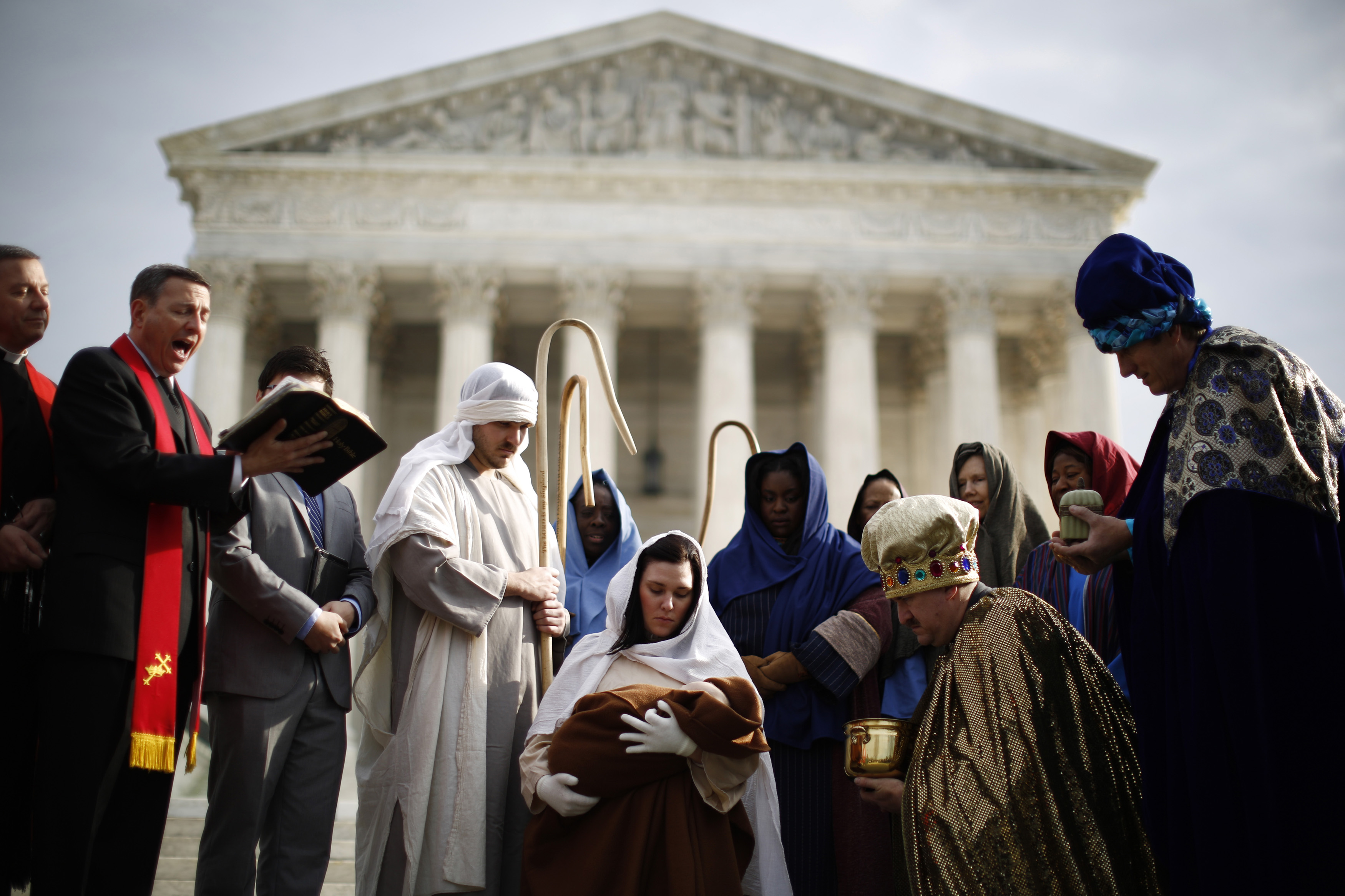 Actors dressed for a nativity scene are pictured during a prayer reading in front of the Supreme Court in Washington December 3, 2013. REUTERS/Jason Reed