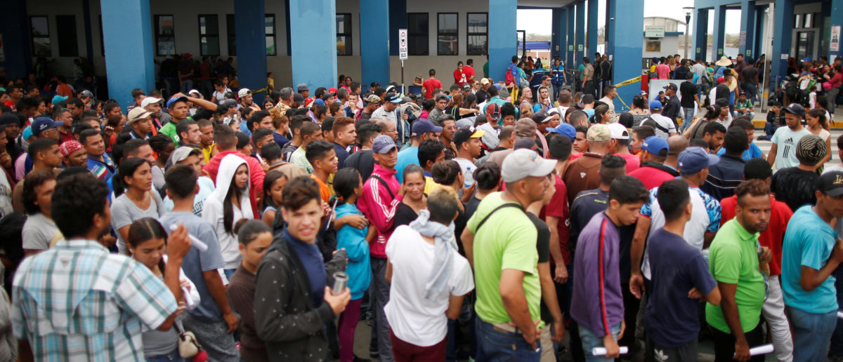 Venezuelan migrants wait to cross border at the Binational Border Service Center of Peru, on the border with Ecuador, in Tumbes