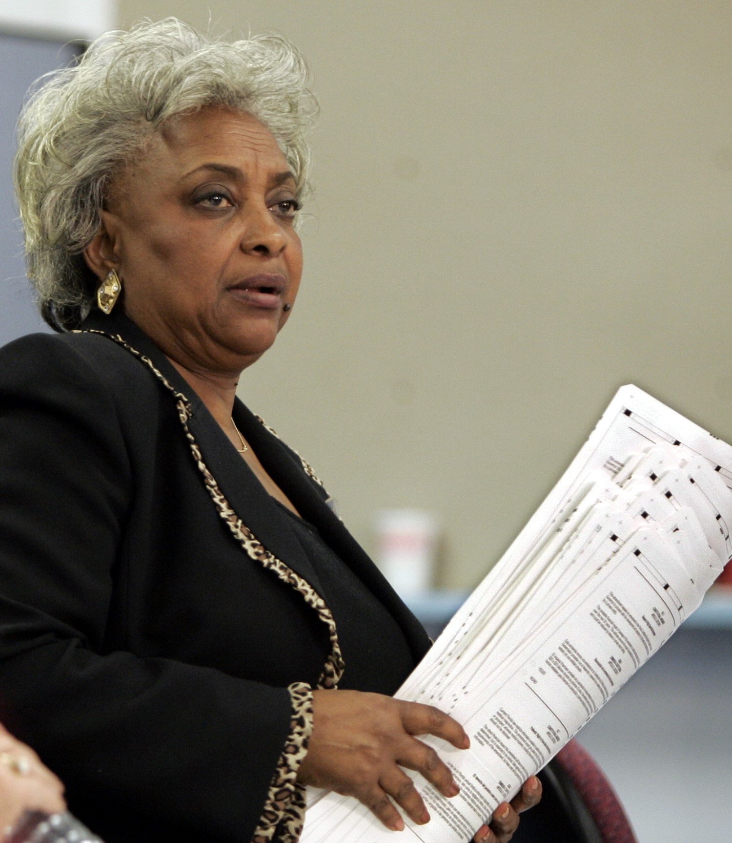 Supervisor of elections for Broward County Dr. Brenda C. Snipes holds a group of overvote ballots at the Broward county election equipment center in Ft Lauderdale, Florida, November 2, 2004. Overvotes are absentee ballots that have a vote for more than one candidate in a category. REUTERS/Gary I Rothstein