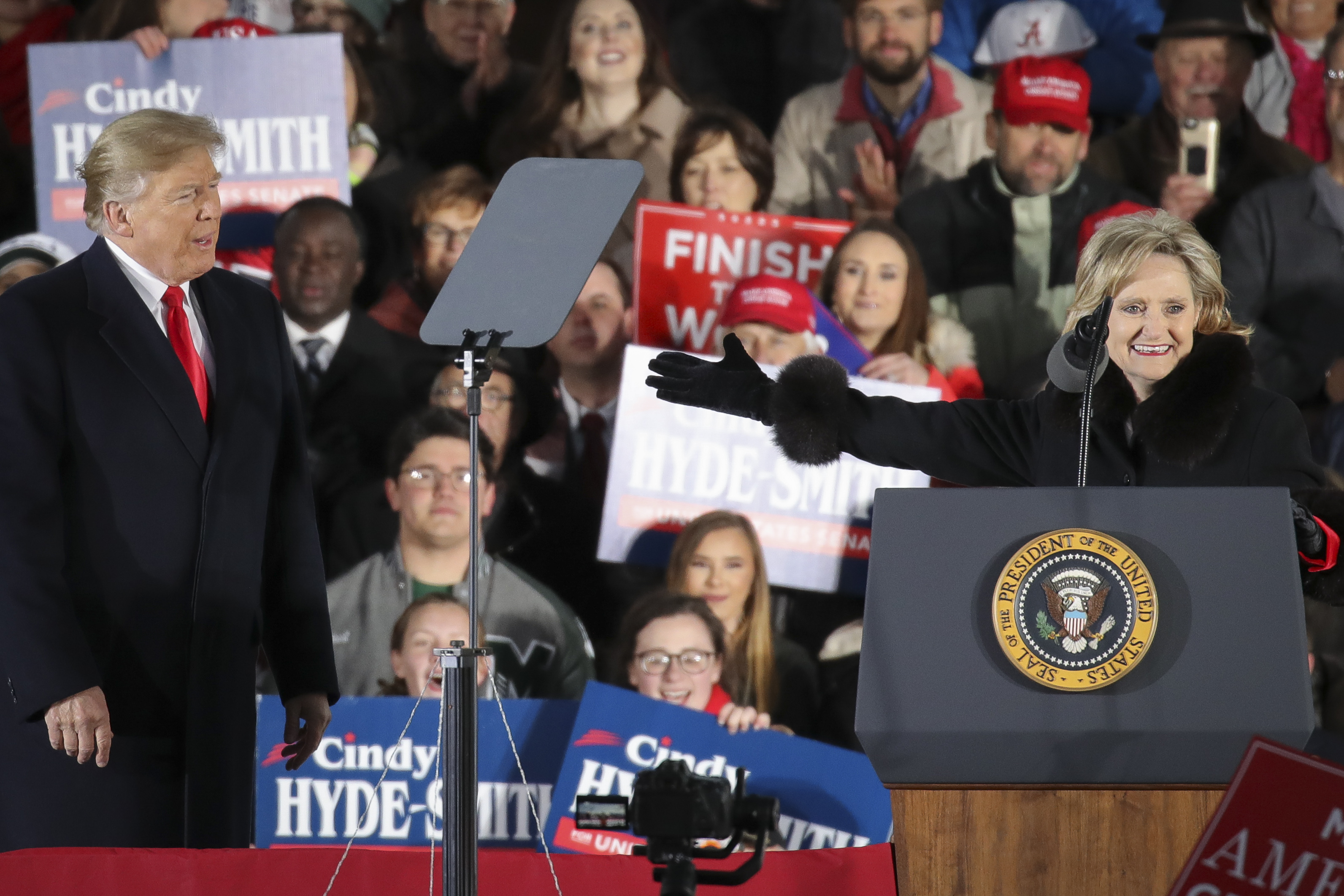 President Donald Trump looks on as Republican candidate for U.S. Senate Cindy Hyde-Smith thanks him during a rally at the Tupelo Regional Airport, November 26, 2018 in Tupelo, Mississippi. (Drew Angerer/Getty Images)