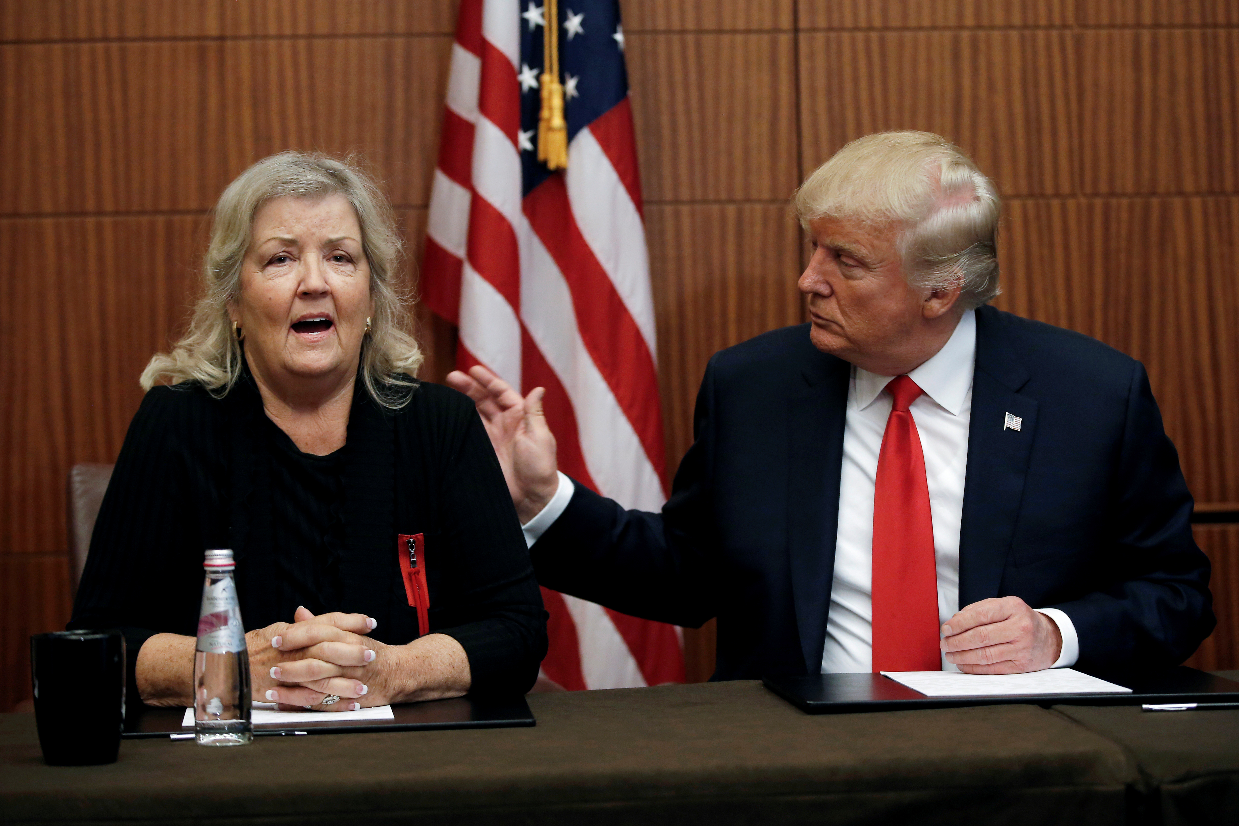 Republican presidential nominee Donald Trump sits with Juanita Broaddrick, in a hotel conference room in St. Louis, Missouri, U.S., shortly before the second presidential debate at Washington University in St. Louis, October 9, 2016. REUTERS/Mike Segar 
