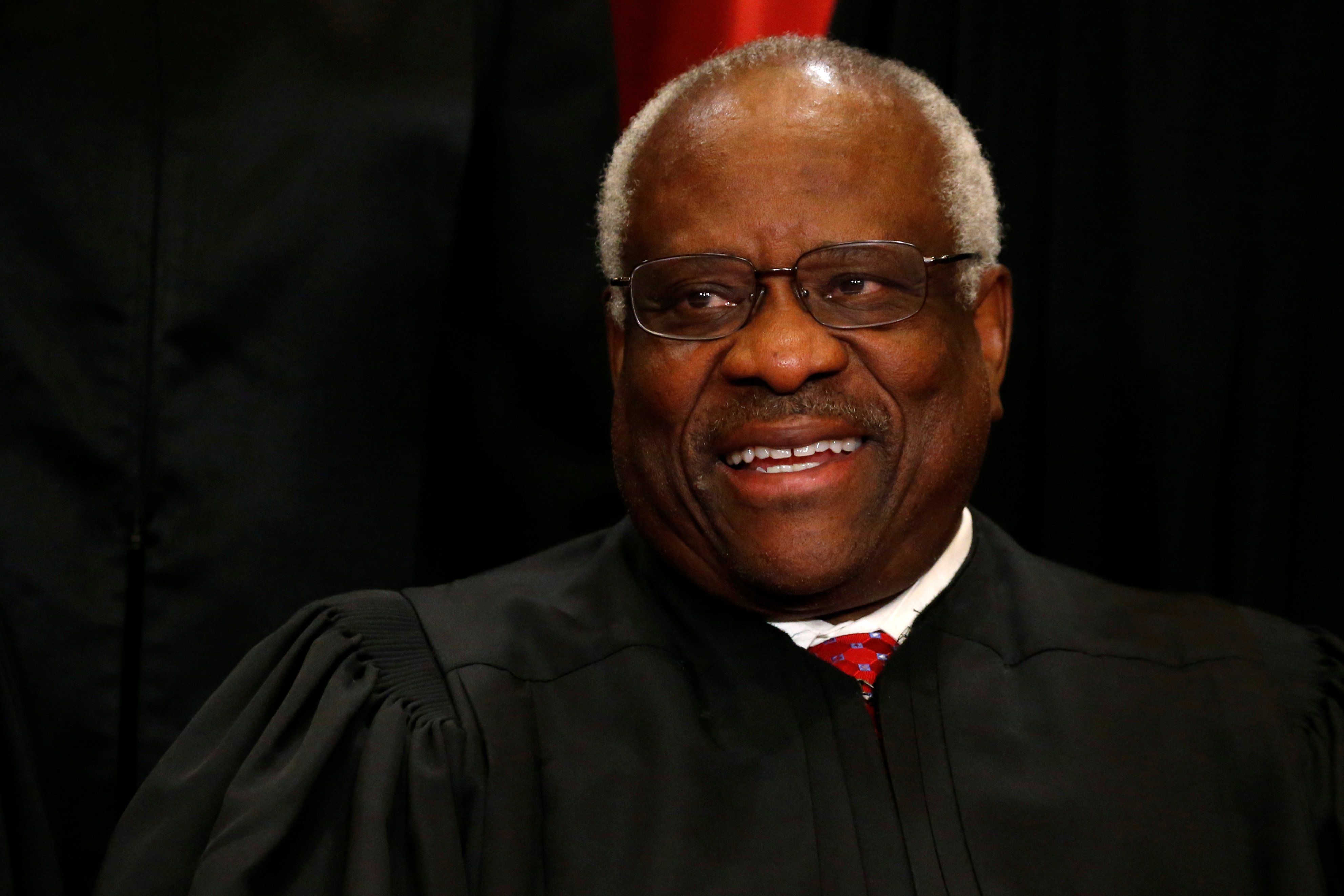 Justice Clarence Thomas participates in taking a new family photo with his fellow justices at the Supreme Court building in Washington, D.C. REUTERS/Jonathan Ernst