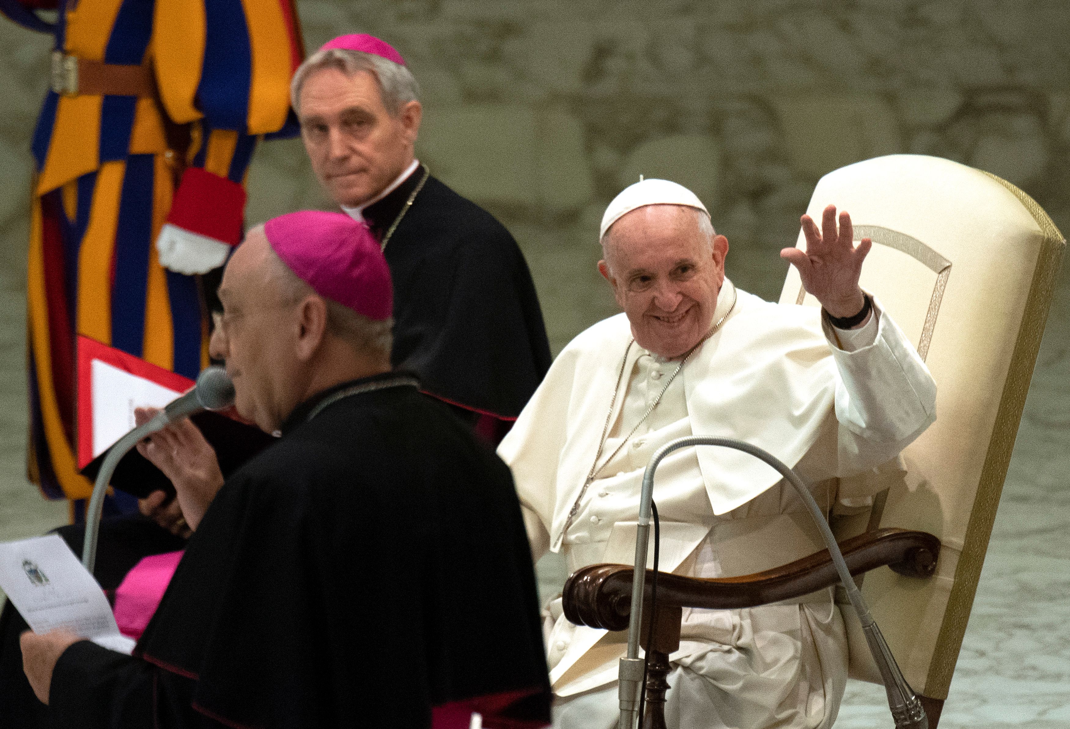 Pope Francis (R) waves before the audience with members of the Molfetta and Ugento dioceses in Paul VI hall at the Vatican on December 1, 2018. (TIZIANA FABI/AFP/Getty Images)