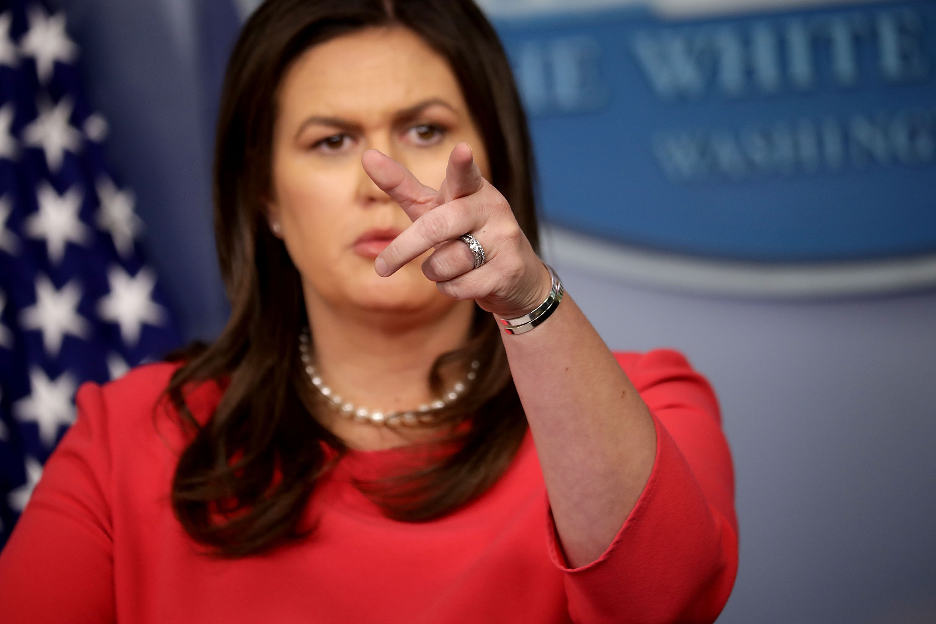 WASHINGTON, DC - JULY 18: White House Press Secretary Sarah Huckabee Sanders calls on reporters during a news conference in the Brady Press Briefing Room at the White House July 18, 2018 in Washington, DC. During the press conference Sanders said that Russian meddling didn't happen under President Donald Trump's watch but under the Obama administration. (Photo by Chip Somodevilla/Getty Images)