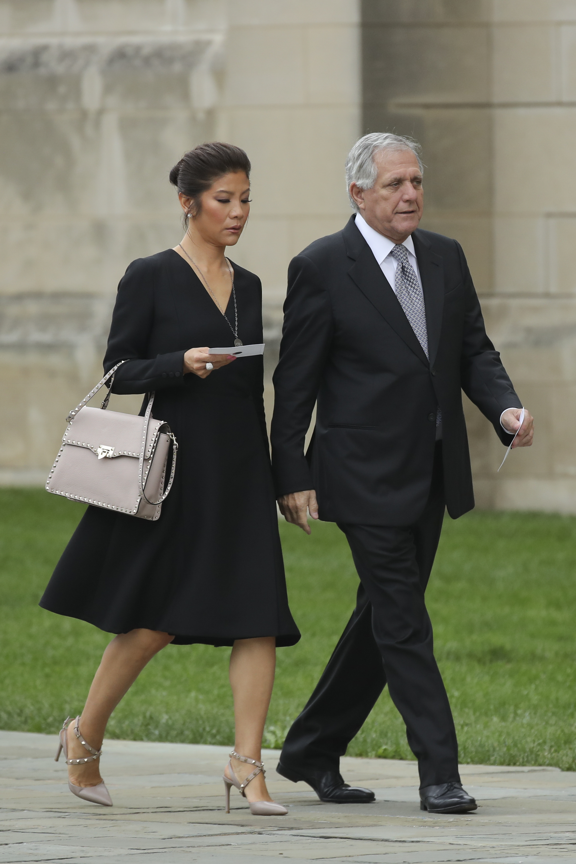WASHINGTON, DC - SEPTEMBER 1: (L-R) Julie Chen and Les Moonves, chief executive officer of CBS Corporation, arrive at the Washington National Cathedral for the funeral service for the late Senator John McCain, September 1, 2018 in Washington, DC. Former presidents Barack Obama and George W. Bush are set to deliver eulogies for McCain in front of the 2,500 invited guests. McCain will be buried on Sunday at the U.S. Naval Academy Cemetery. (Photo by Drew Angerer/Getty Images)