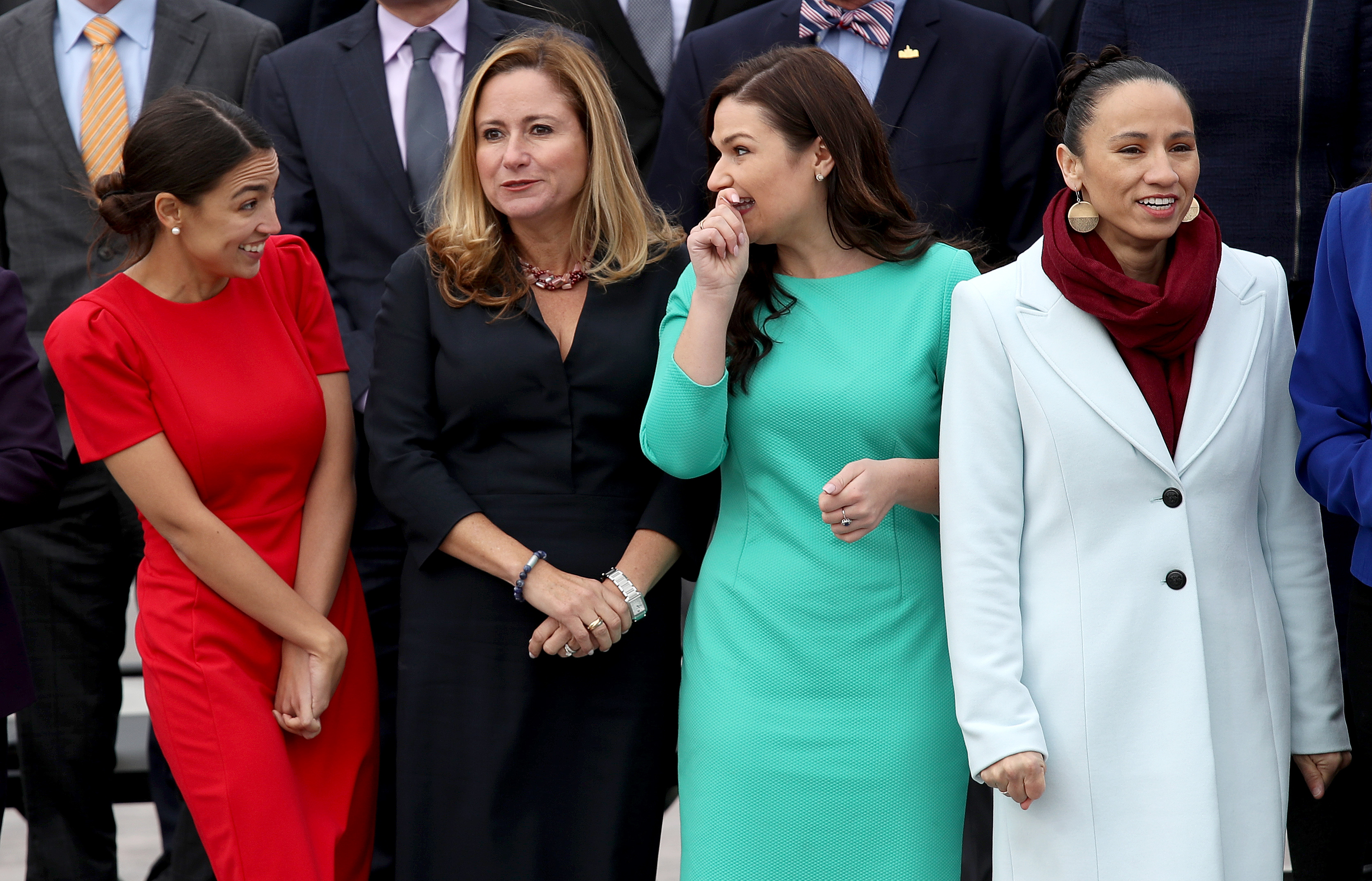 WASHINGTON, DC - NOVEMBER 14: (L-R) Representatives-elect Alexandria Ocasio-Cortez (D-NY), Debbie Mucarsel-Powell (D-FL) Abby Finkenauer (D-IA), and Sharice Davids (D-KS) join with other newly elected members of the House of Representatives for an official class photo of new House members at the U.S. Capitol on November 14, 2018 in Washington, DC. Newly elected members of the House are in Washington this week for orientation meetings. (Photo by Win McNamee/Getty Images)