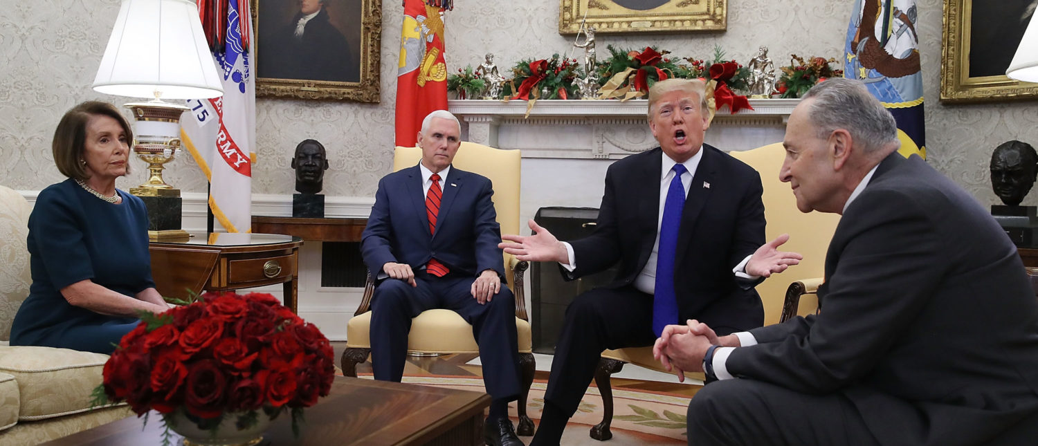 WASHINGTON, DC - DECEMBER 11: U.S. President Donald Trump (2R) argues about border security with Senate Minority Leader Chuck Schumer (D-NY) (R) and House Minority Leader Nancy Pelosi (D-CA) as Vice President Mike Pence sits nearby in the Oval Office on December 11, 2018 in Washington, DC. (Photo by Mark Wilson/Getty Images)