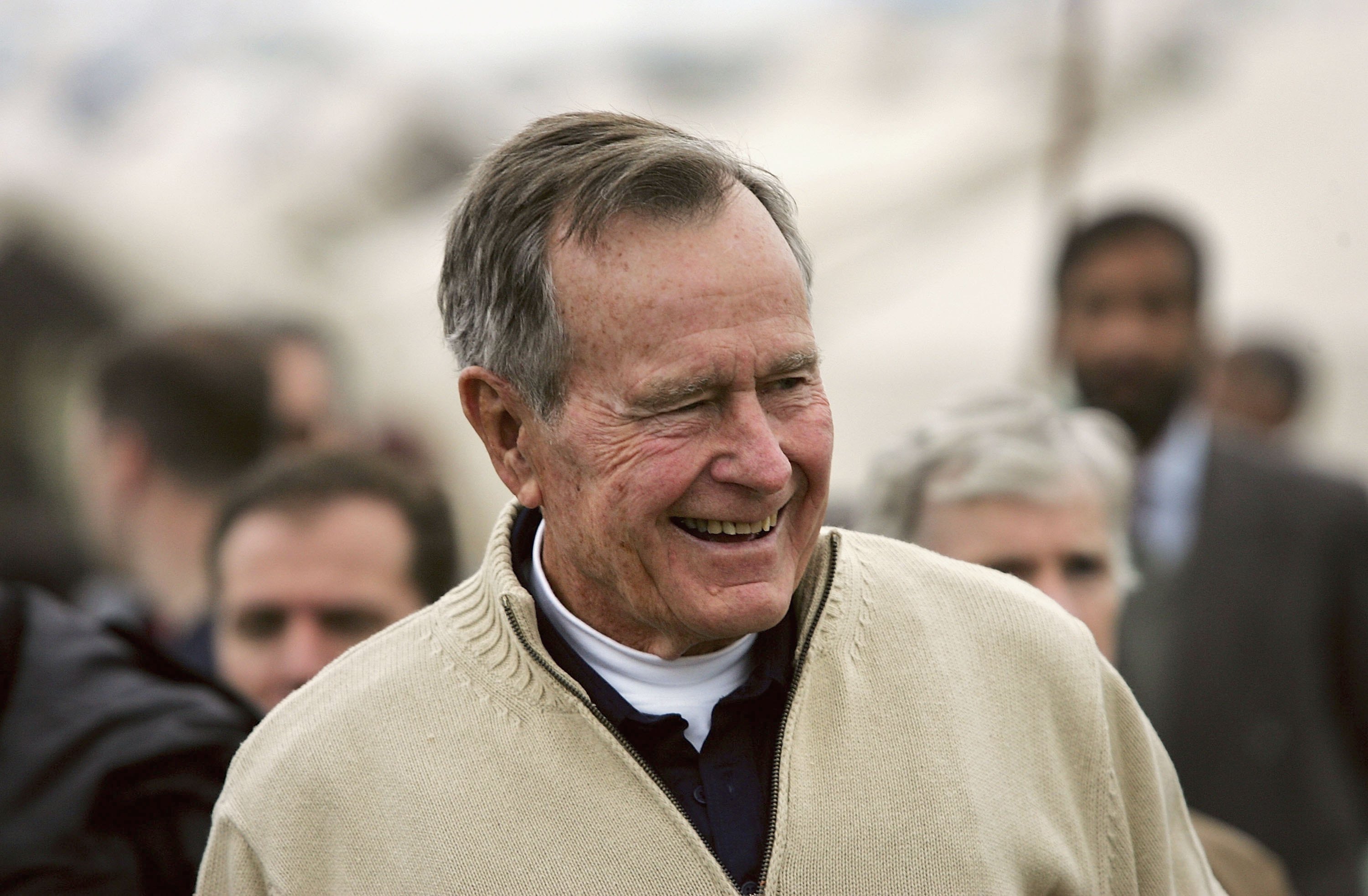 Former U.S. President George Bush visits a tent camp for earthquake survivors on the outskirts of Islamabad on January 17, 2006 in Pakistan. (Photo by John Moore/Getty Images)