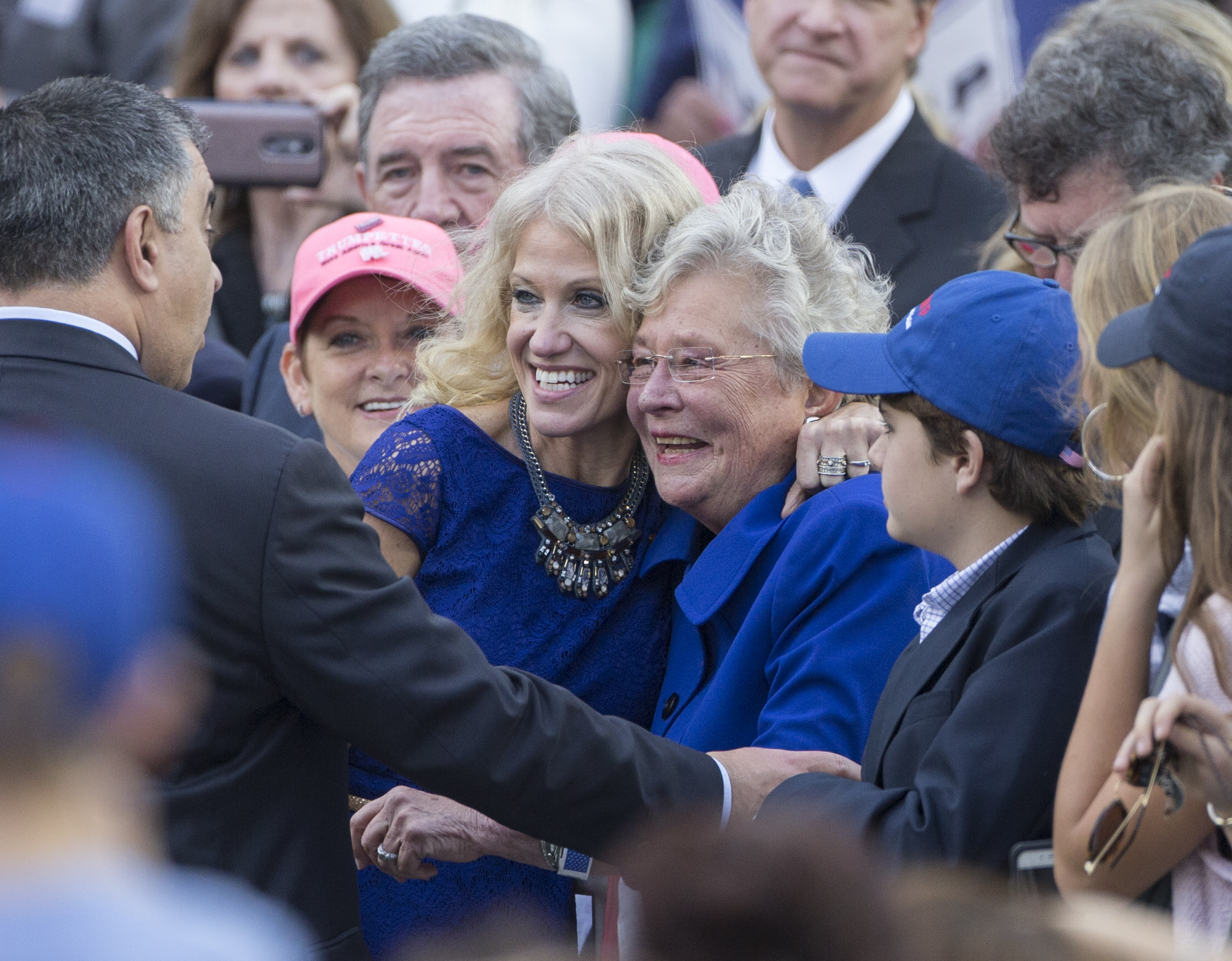 President-elect Donald Trump's campaign manager Kellyanne Conway, left, poses for photos with Alabama Lieutenant Governor Kay Ivey during a thank you rally in Ladd-Peebles Stadium on December 17, 2016 in Mobile, Alabama. (Photo by Mark Wallheiser/Getty Images)