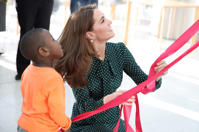 Britain's Catherine, Duchess of Cambridge, and Cruz Brown, age four, unveil a banner featuring Cruz, during a visit to Evelina London Children's Hospital in London, Britain December 11, 2018. Chris Jackson/Pool via REUTERS