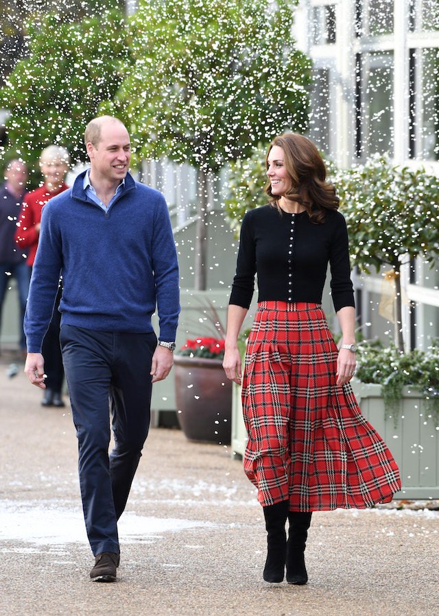Prince William, Duke of Cambridge and Catherine, Duchess of Cambridge laugh as a machine sprays snow ahead of their royal highnesses hosting a Christmas party to deliver a message of support to deployed personnel serving in Cyprus and their families over the festive period, at Kensington Palace on December 04, 2018 in London, England. Approximately 7,500 military personnel are currently serving overseas at Christmas. (Photo by Stuart C. Wilson/Getty Images)
