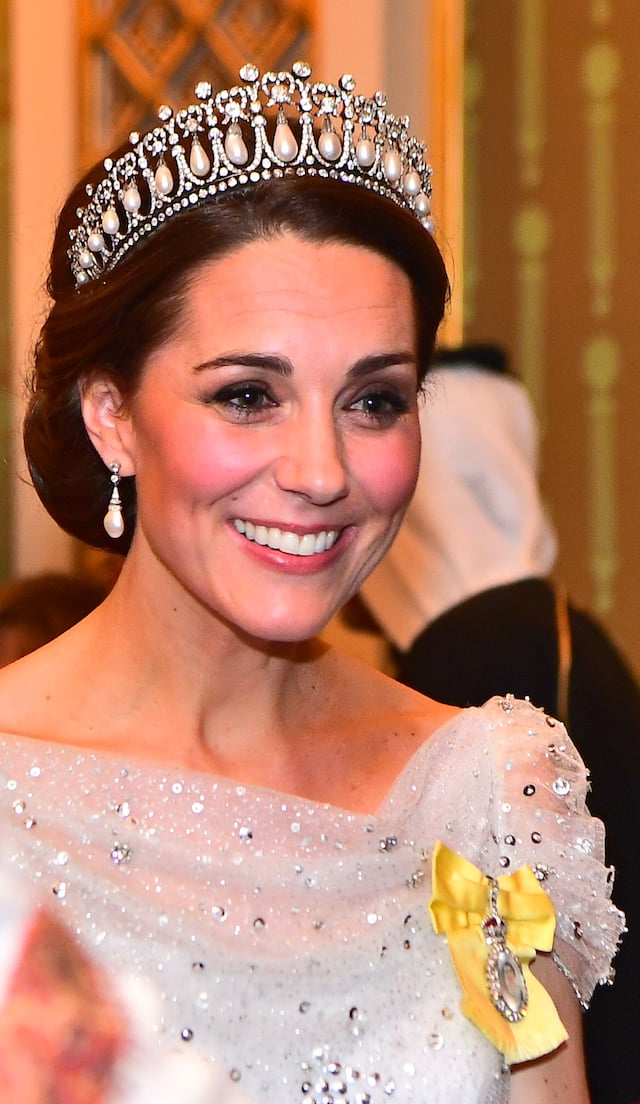 Catherine, Duchess of Cambridge greets guests at an evening reception for members of the Diplomatic Corps at Buckingham Palace on December 04, 2018 in London, England. Approximately 7,500 military personnel are currently serving overseas at Christmas. (Photo by Victoria Jones - WPA Pool/Getty Images)