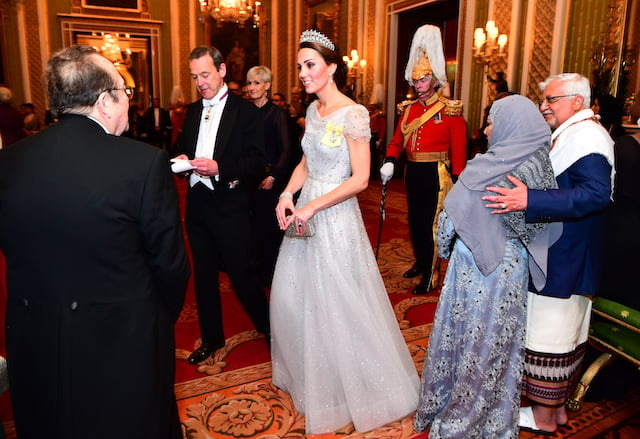 Catherine, Duchess of Cambridge greets guests at an evening reception for members of the Diplomatic Corps at Buckingham Palace on December 04, 2018 in London, England. Approximately 7,500 military personnel are currently serving overseas at Christmas. (Photo by Victoria Jones - WPA Pool/Getty Images)