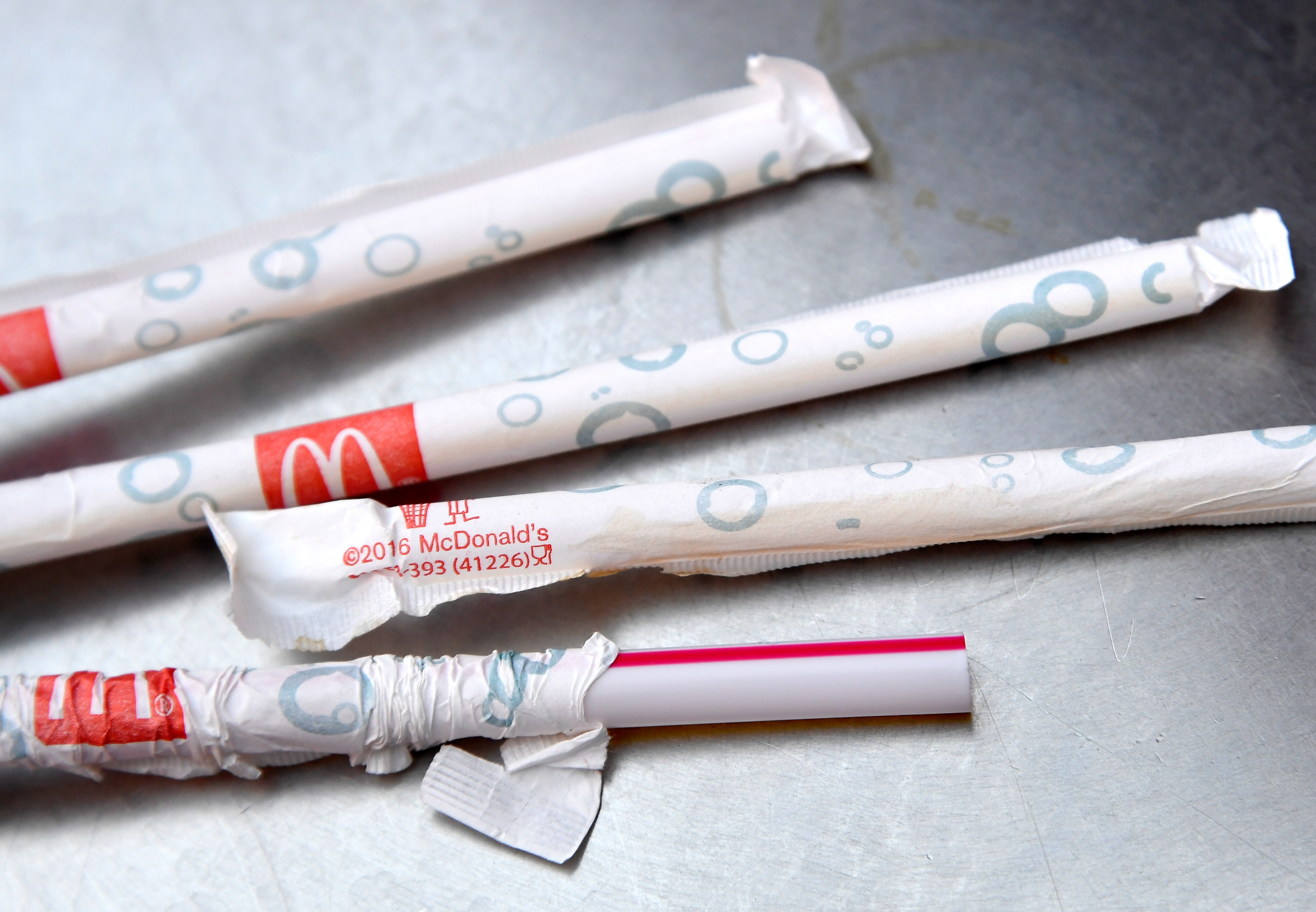 Plastic straws can be seen at a McDonald's restaurant, after it was revealed that they are to replace their plastic straws with paper ones in UK and Ireland restaurants, in London, Britain, June 15, 2018. REUTERS/Toby Melville