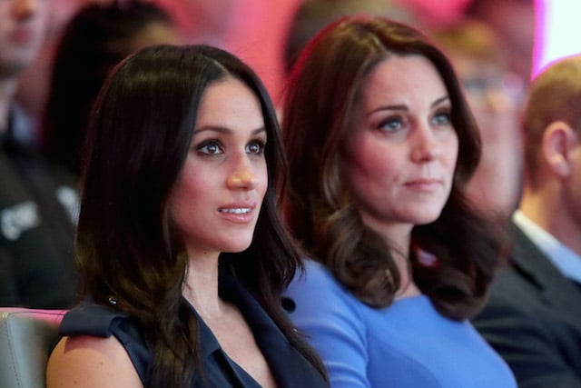 US actress and fiancee of Britain's Prince Harry Meghan Markle (L) and Britain's Catherine, Duchess of Cambridge attend the first annual Royal Foundation Forum on February 28, 2018 in London. (Photo credit: CHRIS JACKSON/AFP/Getty Images)