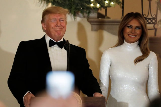 U.S. President Donald Trump speaks next to First Lady Melania Trump at the Congressional Ball at White House in Washington on December 15, 2018. (Photo by Yuri Gripas-Pool/Getty Images)