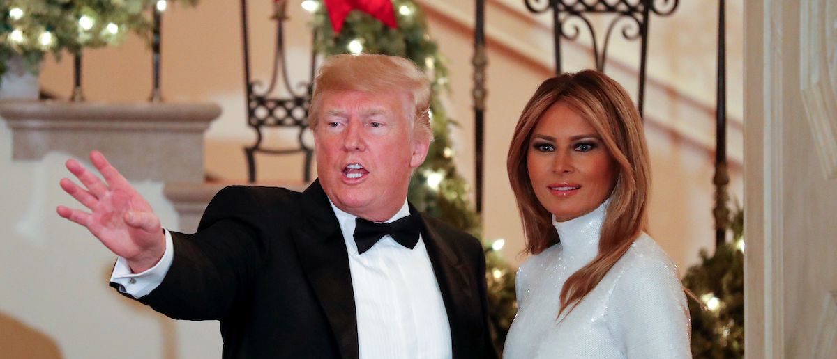 US President Donald Trump and First Lady Melania Trump (R) greet guests during the Congressional Ball at the White House in Washington DC on December 15, 2018. (Photo credit: ROBERTO SCHMIDT/AFP/Getty Images)