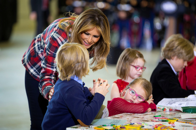 U.S. first lady Melania Trump greets children as they draw holiday cards during the Marine Corps Reserve Toys for Tots campaign at Joint Base Anacostia-Bolling in Washington, U.S., December 11, 2018. REUTERS/Al Drago