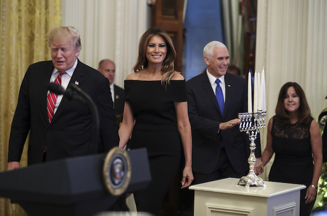 President Donald Trump, first lady Melania Trump, Vice President Mike Pence and his wife Karen Pence attend a Hanukkah reception in the East Room of the White House on December 6, 2018 in Washington, DC. (Photo by Oliver Contreras-Pool/Getty Images)