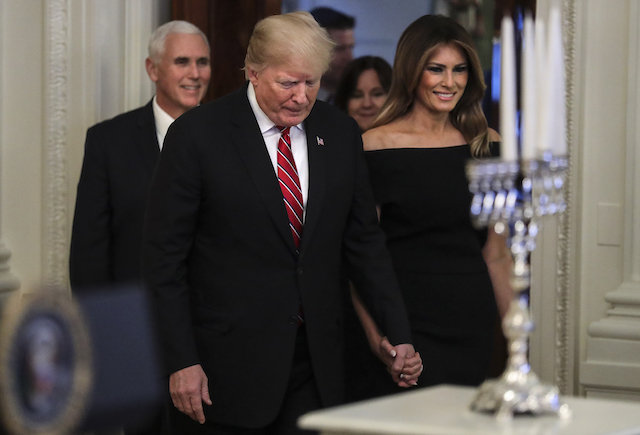 President Donald Trump and first lady Melania Trump attend a Hanukkah reception in the East Room of the White House on December 6, 2018 in Washington, DC. (Photo by Oliver Contreras-Pool/Getty Images)