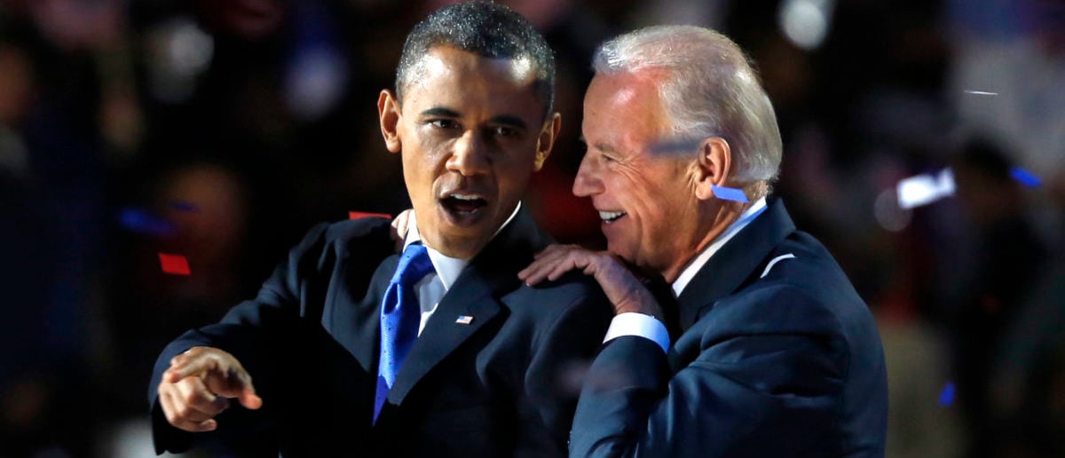 U.S. President Barack Obama gestures with Vice President Joe Biden after his election night victory speech in Chicago, November 6, 2012. REUTERS/Larry Downing