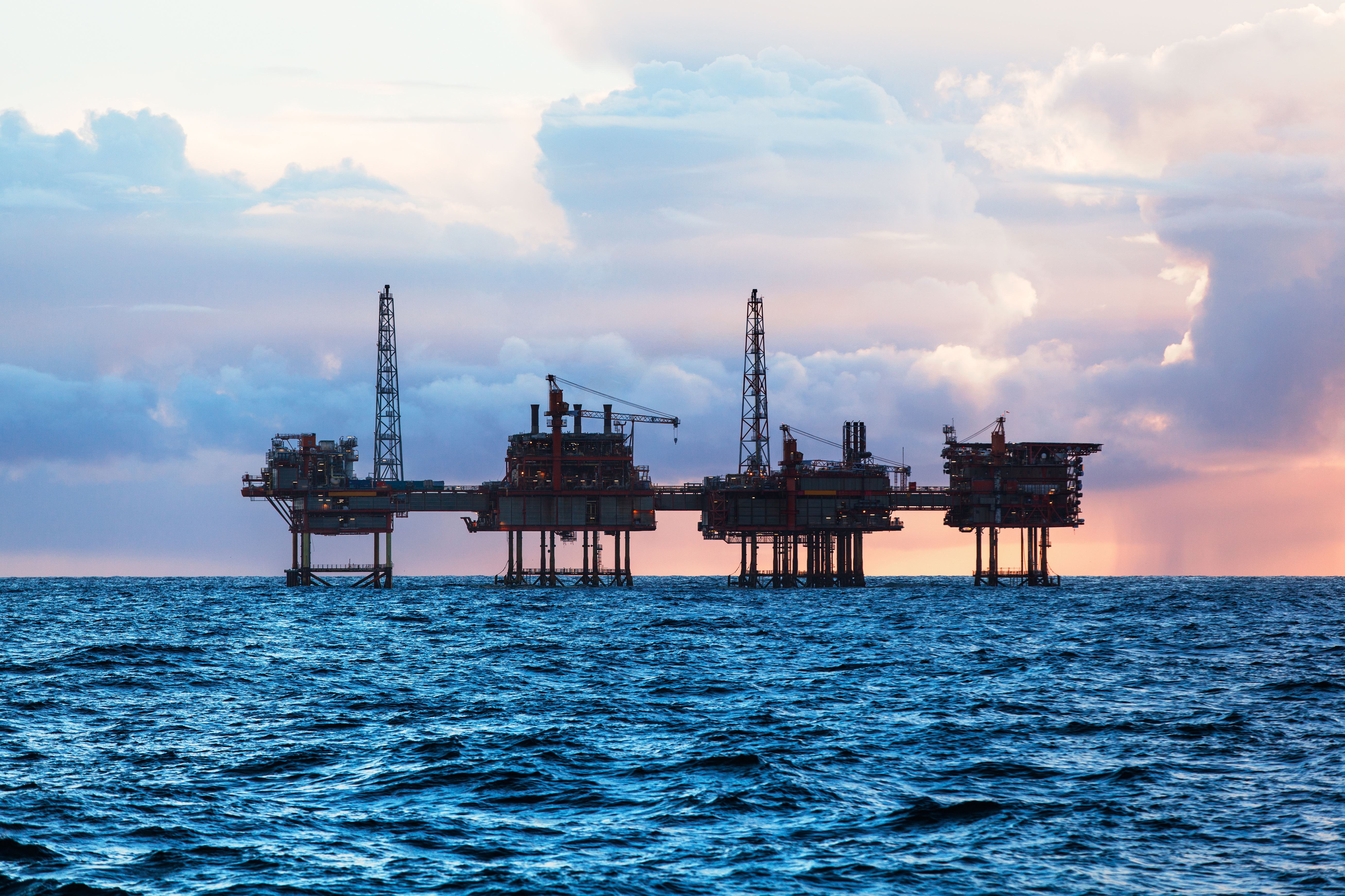 Offshore oil rig at sunset. (Shutterstock/Lukasz Z)