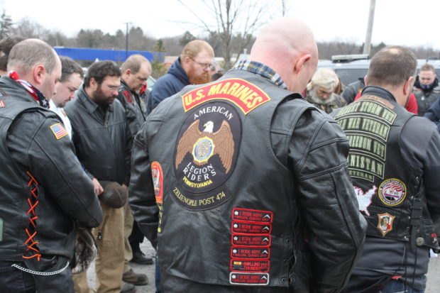 Members of the Patriot Guard Riders, volunteers firemen, and law enforcement officers gather in prayer before escorting the family of Staff Sgt. Dylan Elchin to a memorial service on Dec. 6, 2018. (Will Racke/TheDCNF)
