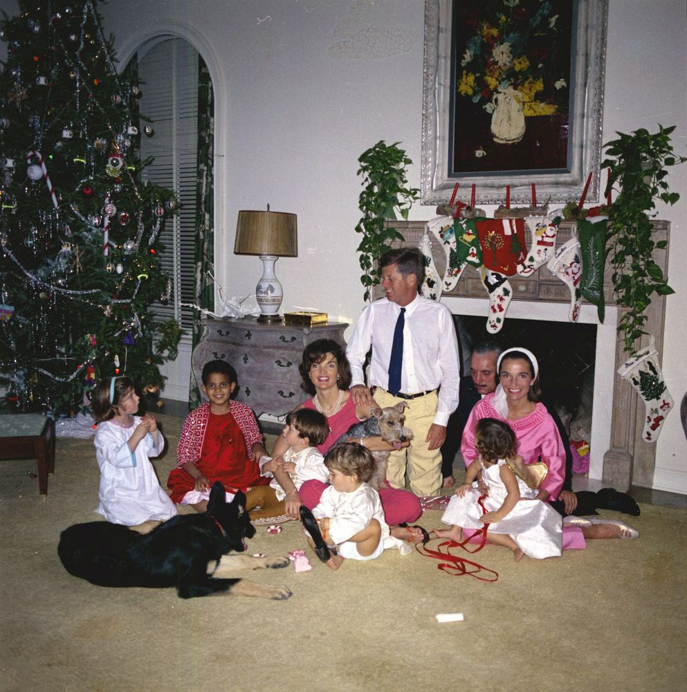 President John F. Kennedy celebrates Christmas with his family at the residence of C. Michael Paul in Palm Beach, Florida, U.S., December 25, 1962. Caroline Kennedy (L to R), Gustavo Paredes, First Lady Jacqueline Kennedy, holding her nephew Anthony Radziwill; John F. Kennedy, Jr.; President Kennedy; Prince Stanislaus Radziwill of Poland; Princess Lee Radziwill (Mrs. KennedyÕs sister), holding her daughter and Anna Christina Radziwill. Courtesy Cecil Stoughton/JFK Library/Handout via REUTERS 