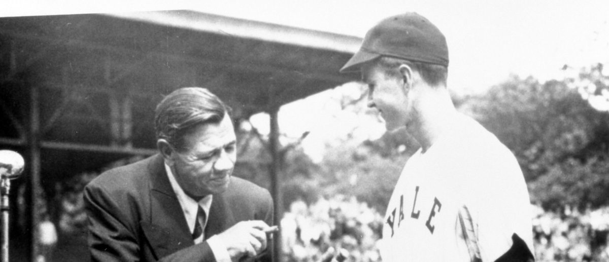 On behalf of Yale University, baseball captain George Bush accepts "The Babe Ruth Story" autobiography from Babe Ruth in this 1948 handout photo obtained by Reuters November 30, 2012. George Bush Presidential Library and Museum/Handout via REUTERS/File Photo